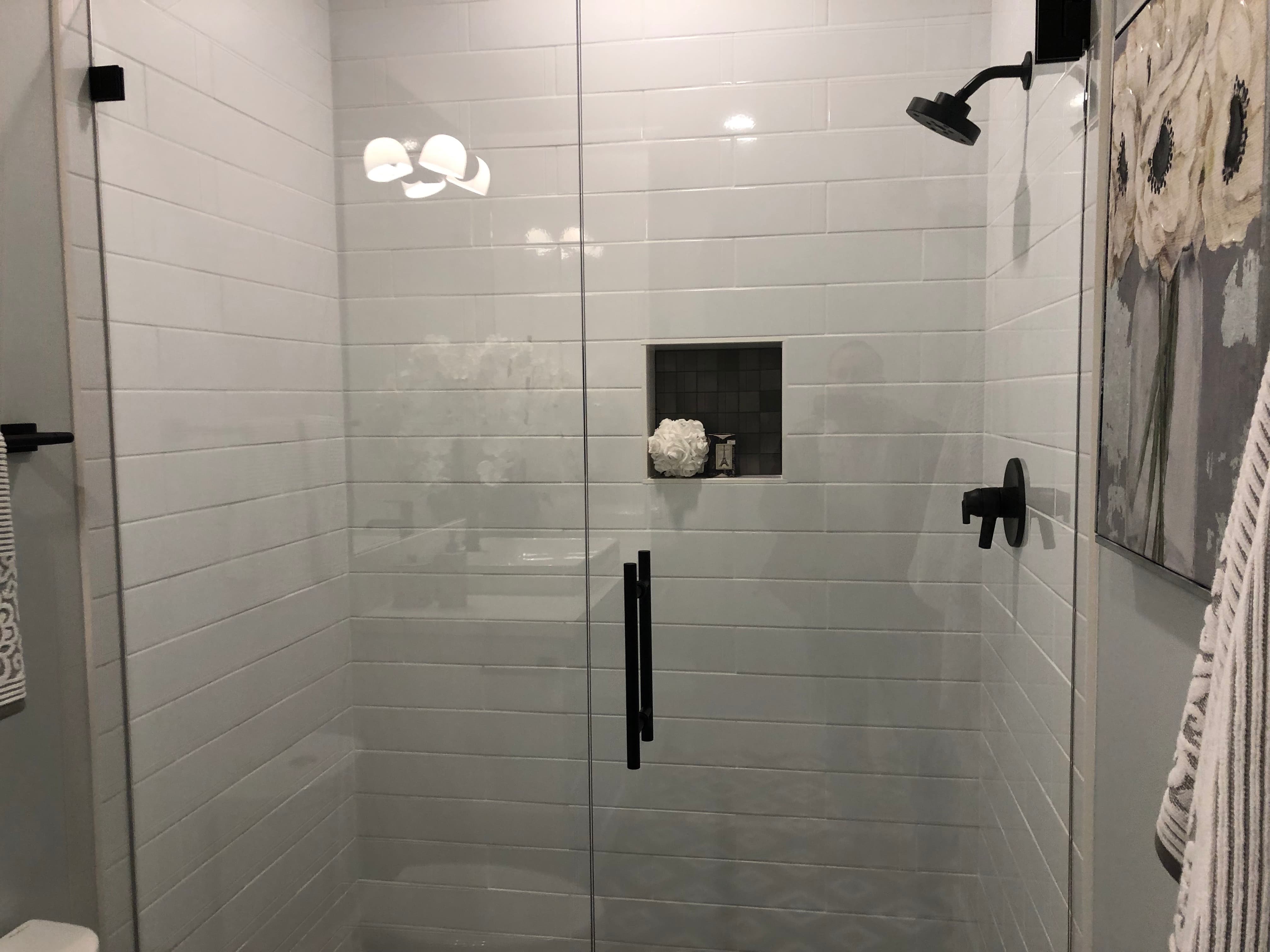Luxury bathroom remodel with walk-in shower and modern tile