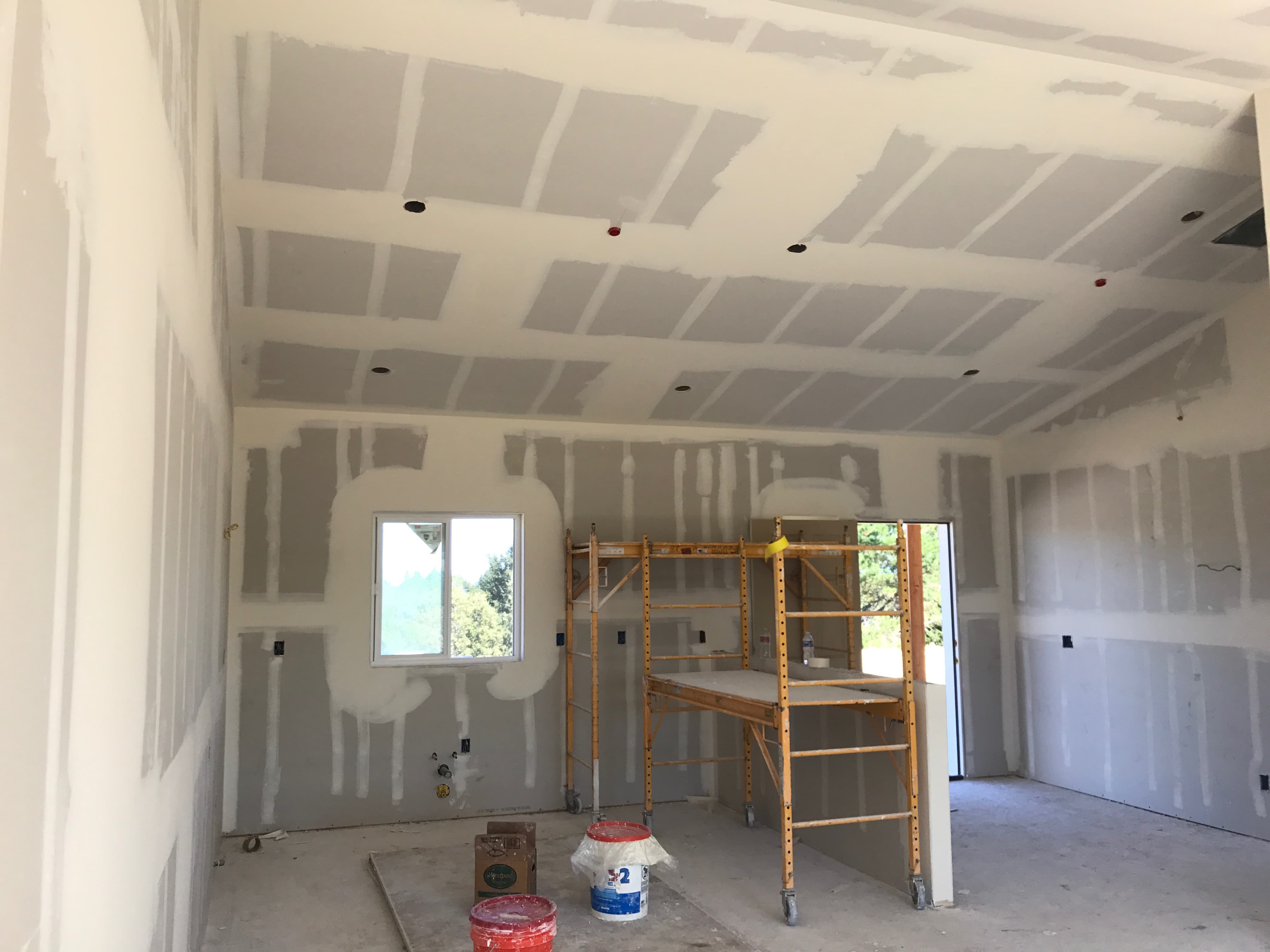 Complete home renovation in progress with drywall and lighting
